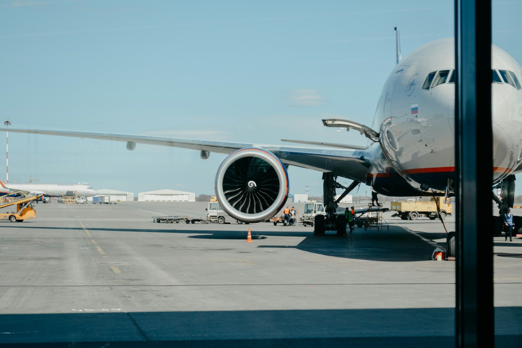 Aircraft on tarmac, precision aerospace manufacturing context