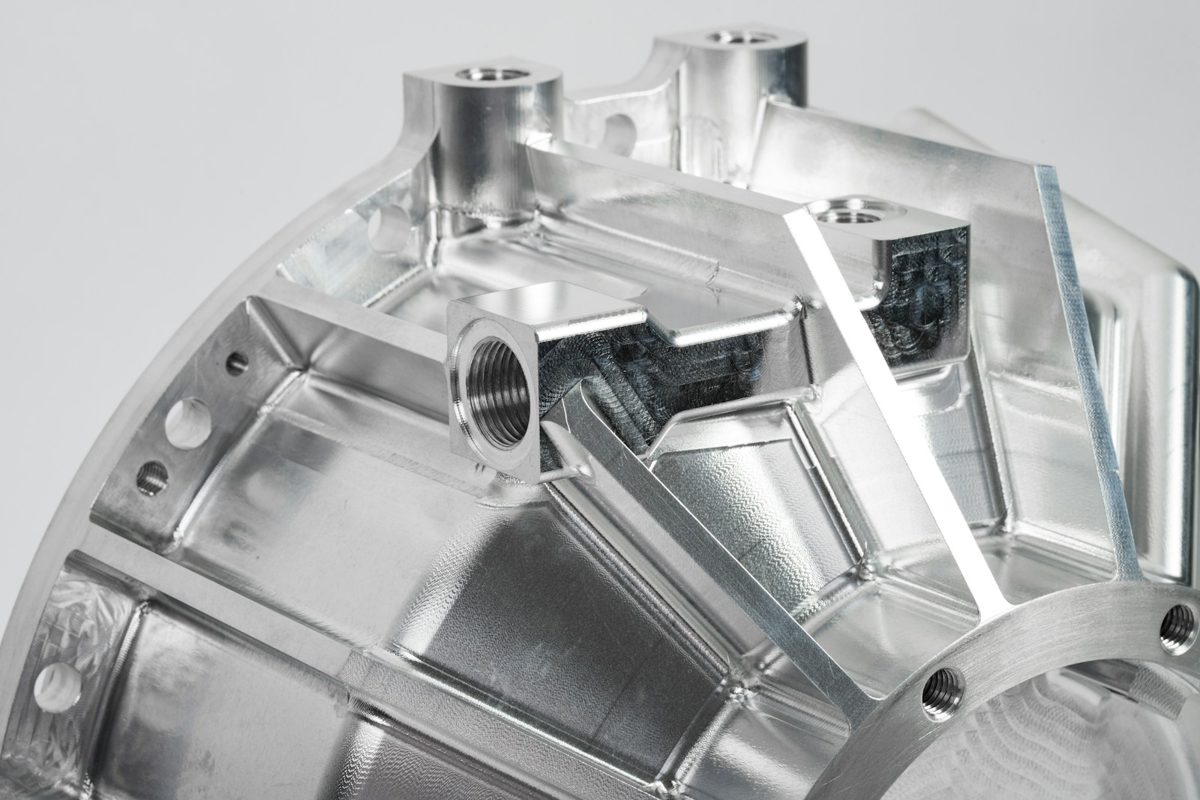 Precision machined aluminum aerospace component, close-up